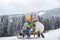 Boy and girl sledding in winter. Kids sibling riding on snow slides in winter. Son and daughter enjoy a sleigh ride