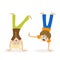 Boy and girl standing upside down on their hands. Children having fun or athletics. Morning exercise or playing sports