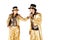 Boy and girl on stilts dressed in gold