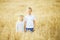 boy and girl in wheat field