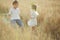 Boy and girl in wheat field