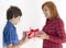 Boy is giving christmas gift to his mother