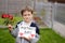 Boy giving his mother self-made greeting card