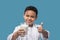 Boy with glass of milk showing ok gesture