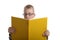 Boy with glasses reading a big yellow book