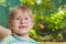 Boy in glasses wiyh aquarium on background