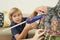 Boy glueing felt pieces