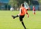 Boy goalkeeper defends the goal