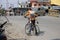 A Boy going on bicycle with his injured little brother