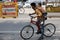 A Boy going on bicyle with his injured little brother