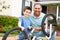 Boy and grandfather fixing bike