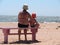 Boy with grandmother on beach