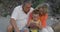 Boy and grandparents looking at photos on smartphone