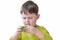 boy in green clothes plays with green soft plasticine. The child does not smile, is focused. Concept - educational games