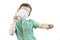 A boy in a green shirt and a medical mask on his face shows the direction with his index fingers. The child put on a medical mask