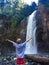 Boy Happy to see Waterfall Pacific Northwest Forest