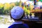 The boy hasidic looks at the pleasure ship in the lake in Uman, Ukraine, the time of the Jewish New Year
