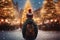 boy in a hat in the central square, looking at a large Christmas tree decorated for Christmas, rear view