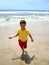 A boy is having fun on bigest and most beautiful beach of Gold Coast Australia