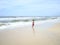 A boy is having fun on bigest and most beautiful beach of Gold Coast Australia