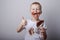 Boy having fun smiling holding a bar of chocolate. Stains on a white chocolate T-shirt