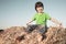 Boy in a haystack in the field