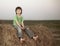 Boy in a haystack in the field