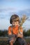 Boy in a haystack in the field