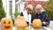 Boy helping girl to carve pumpkin jack-o-lantern, first love, little gentleman