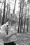 boy hides his face with a mirror. The problem of socialization, depression. Black and white