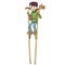 Boy on high stilts with a cat on his shoulder