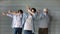 Boy, his dad and grandpa training dance together, enjoying activities