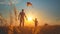 A boy and his dad launch a multi-colored kite into the sky on a field on a sunny summer day