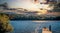 Boy and his Dog on Dock at Sunset