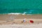 Boy and his mother on beach with inflatable float