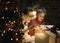 Boy and his mother opening Christmas gifts