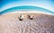 The boy with his mother sunbathe on the beach