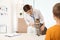 Boy with his pet visiting veterinarian in clinic