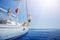 Boy with his sister jump of sailing yacht on summer cruise. Travel adventure, yachting with child