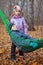 A boy with his sister relaxing in a hammock