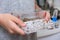 A boy holding an acrillic ant farm, formicarium in hands, research model of ant colony