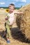 Boy holding a blooming sunflower