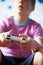 Boy Holding Controller Playing Video Game