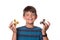 Boy holding fidget spinners in front of eyes