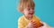 Boy holding a grapefruit. Healthy food