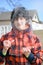 Boy Holding a Large Sheet of Ice from Lake