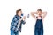 Boy holding megaphone and screaming at littke girl closing ears