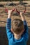 A Boy Holding Metal Rings