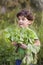 Boy holding organic lettuce