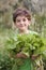 Boy holding organic lettuce